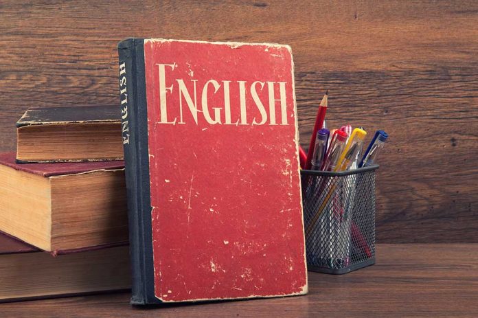 Learning,English,Concept.,Book,On,A,Wooden,Background English Proficiency Test May Be Required For Immigration