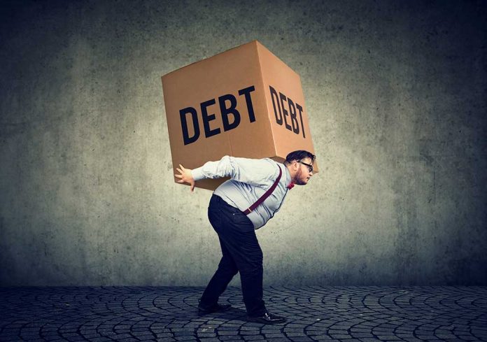 Americans in Massive Debt While Living Paycheck to Paycheck